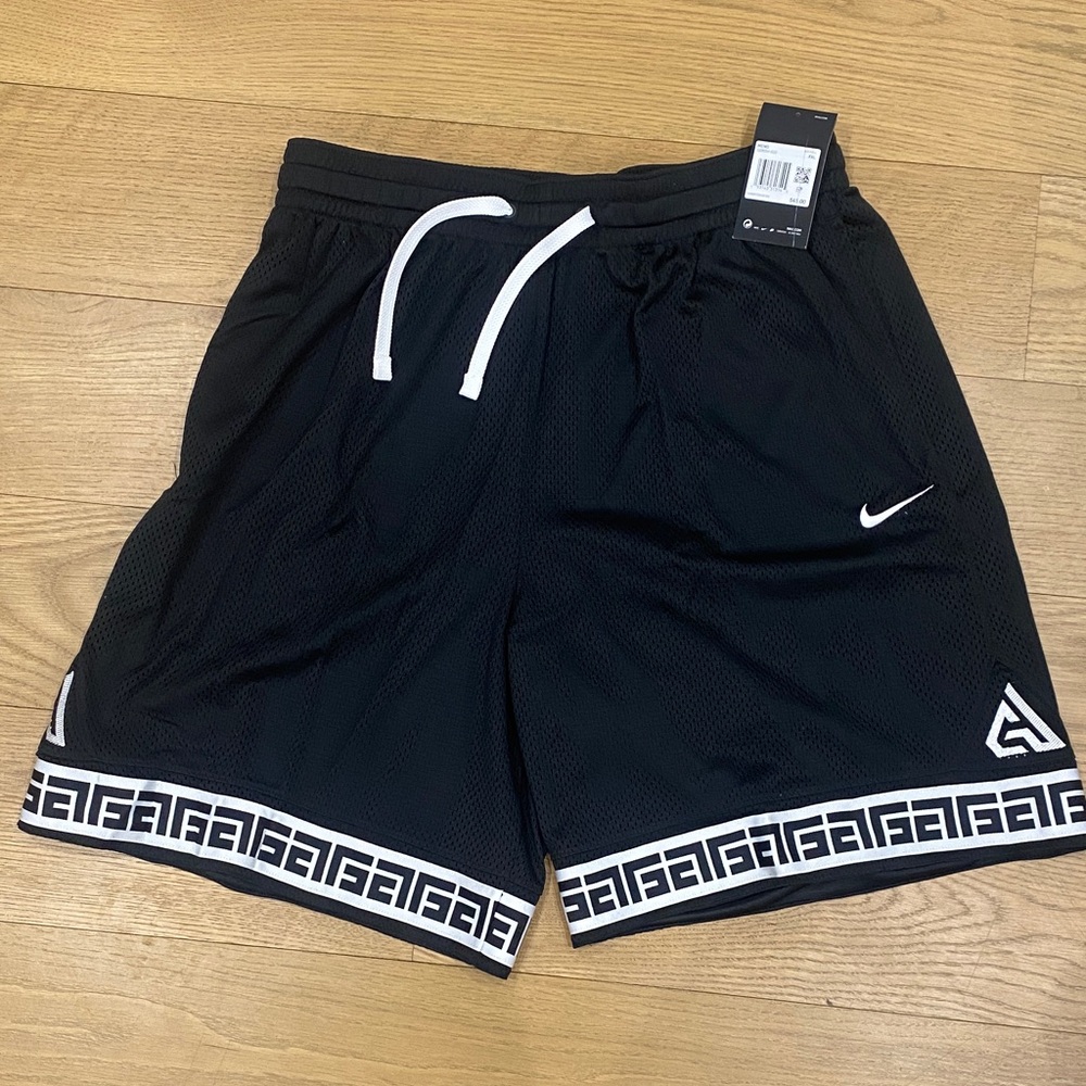 Nike Black Mesh Athletic Shorts with White Trim and Drawstring